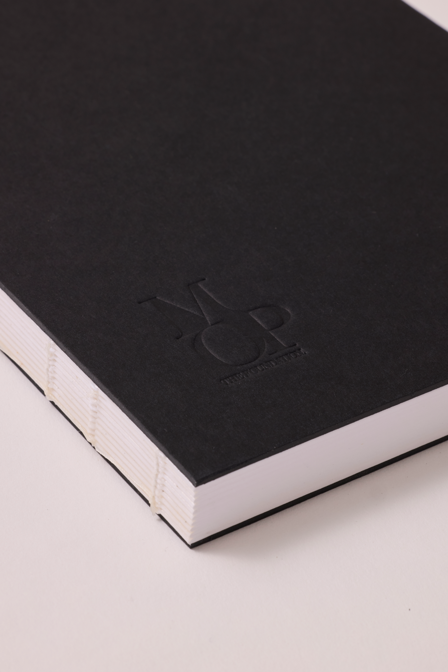 Black stitched spine notebook