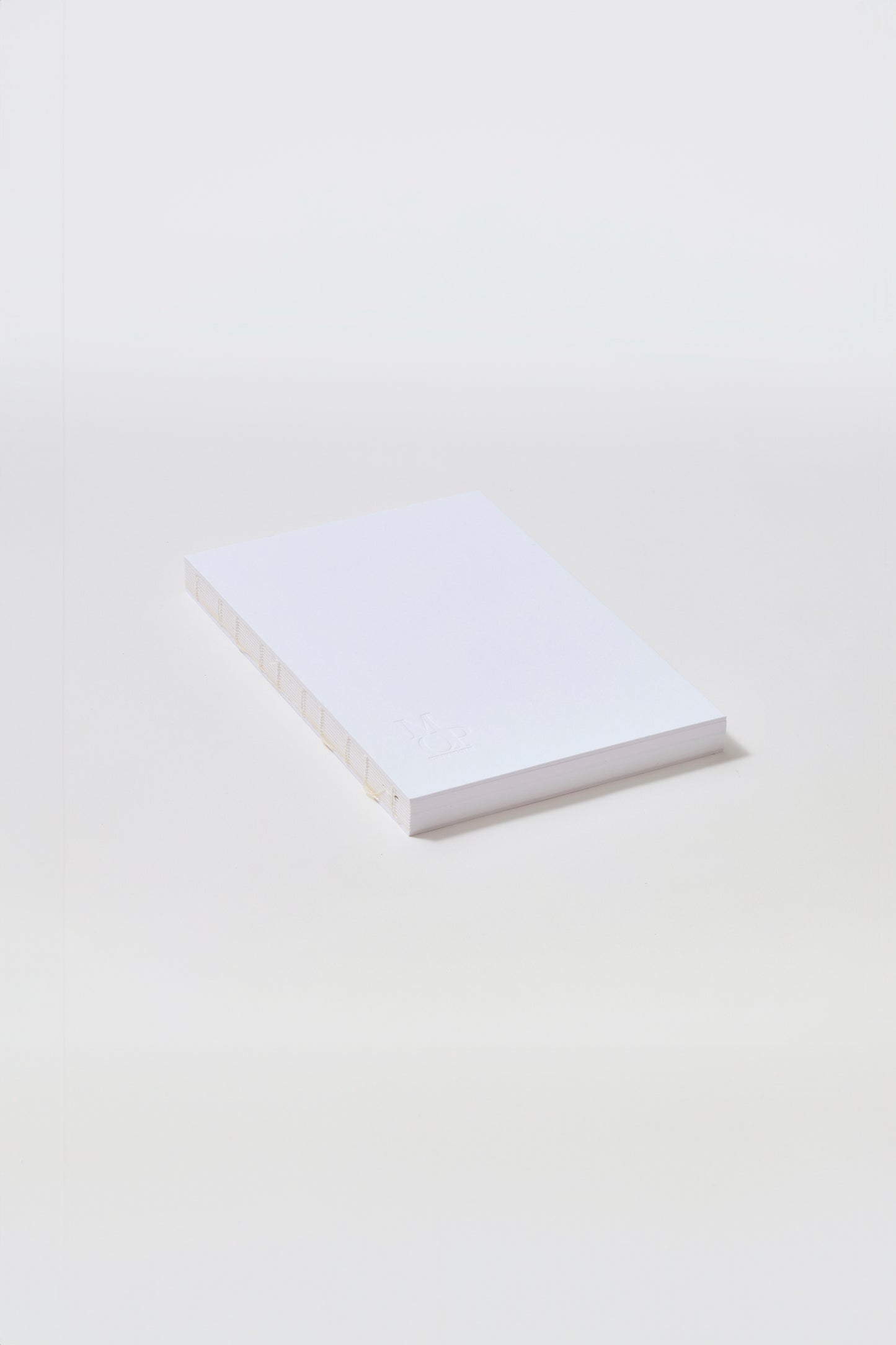 White stitched spine notebook